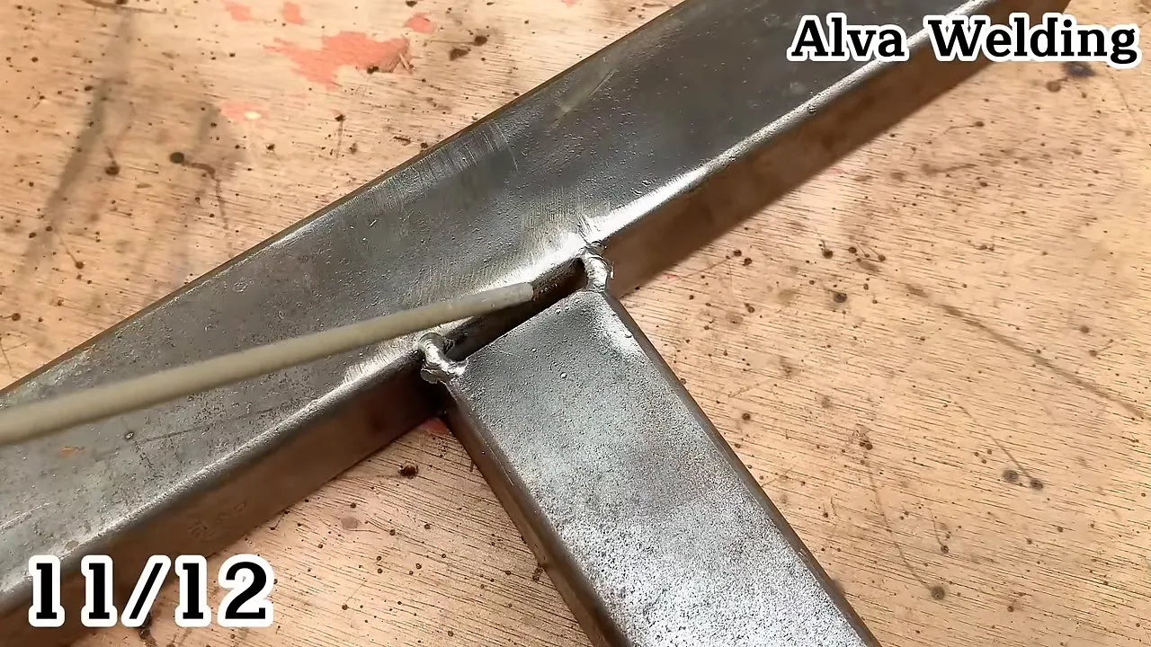 Chipping slag from a completed weld bead