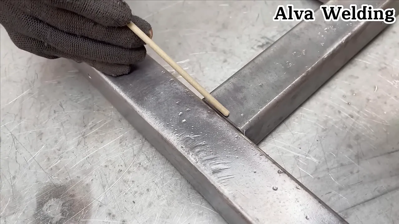 Demonstration of travel and work angles while welding a seam