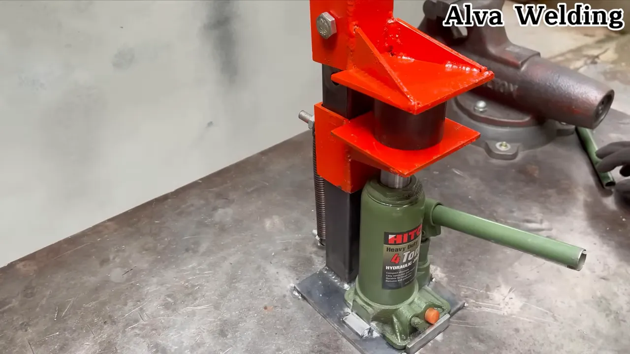 final press in use with a long handle attached to the jack lever