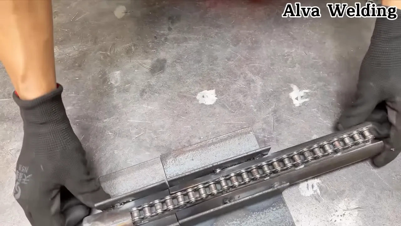 Tack-welding jaw plate to square tube frame