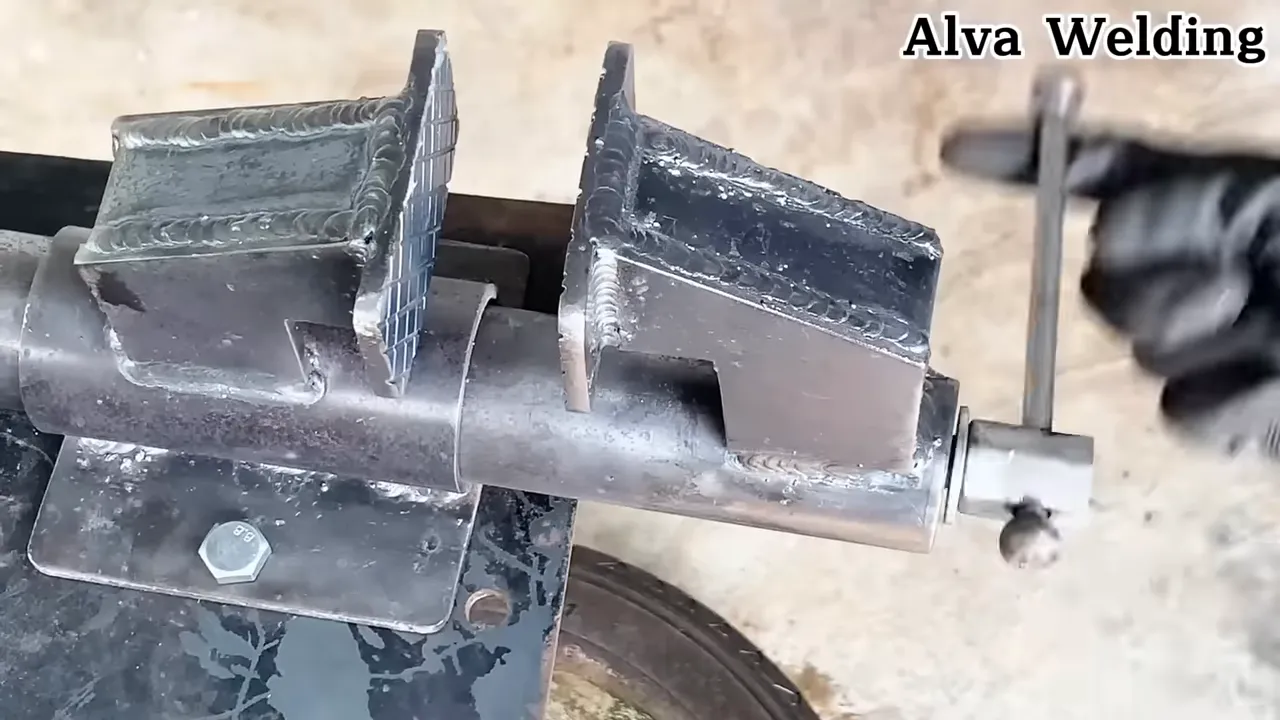 Close-up of tack weld and fixturing for thin metal