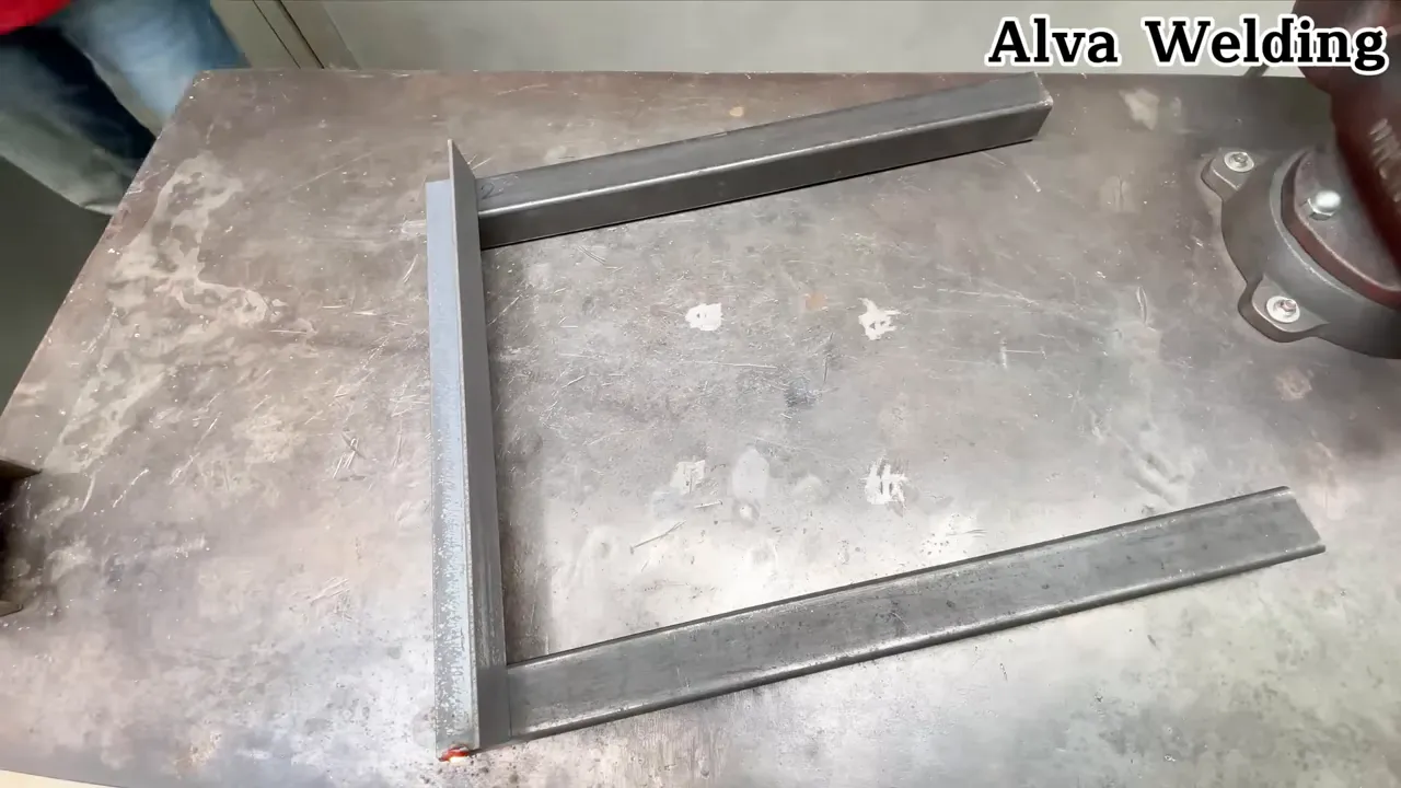 welding the column to the base with a steady hand