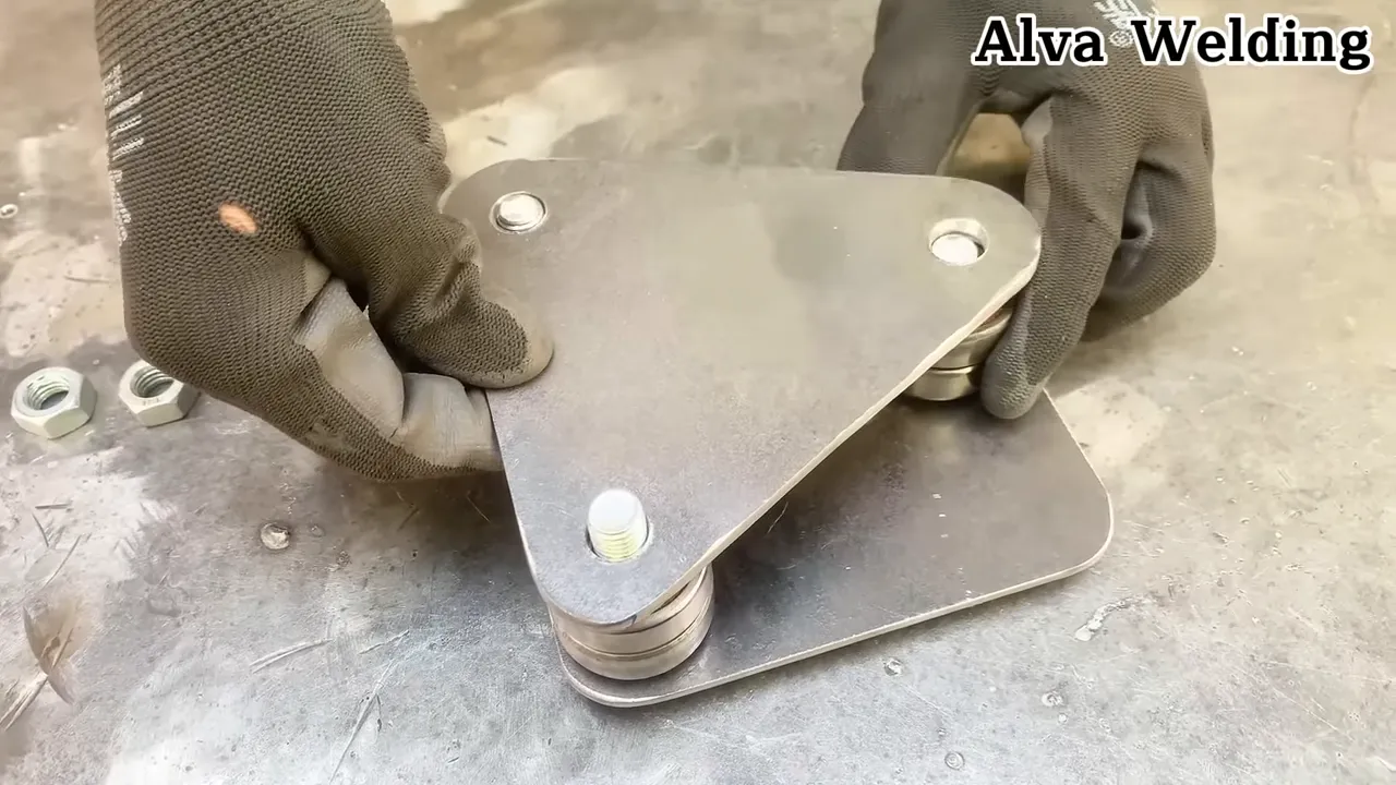 pipe held in a custom saddle jig being cut with an angle grinder