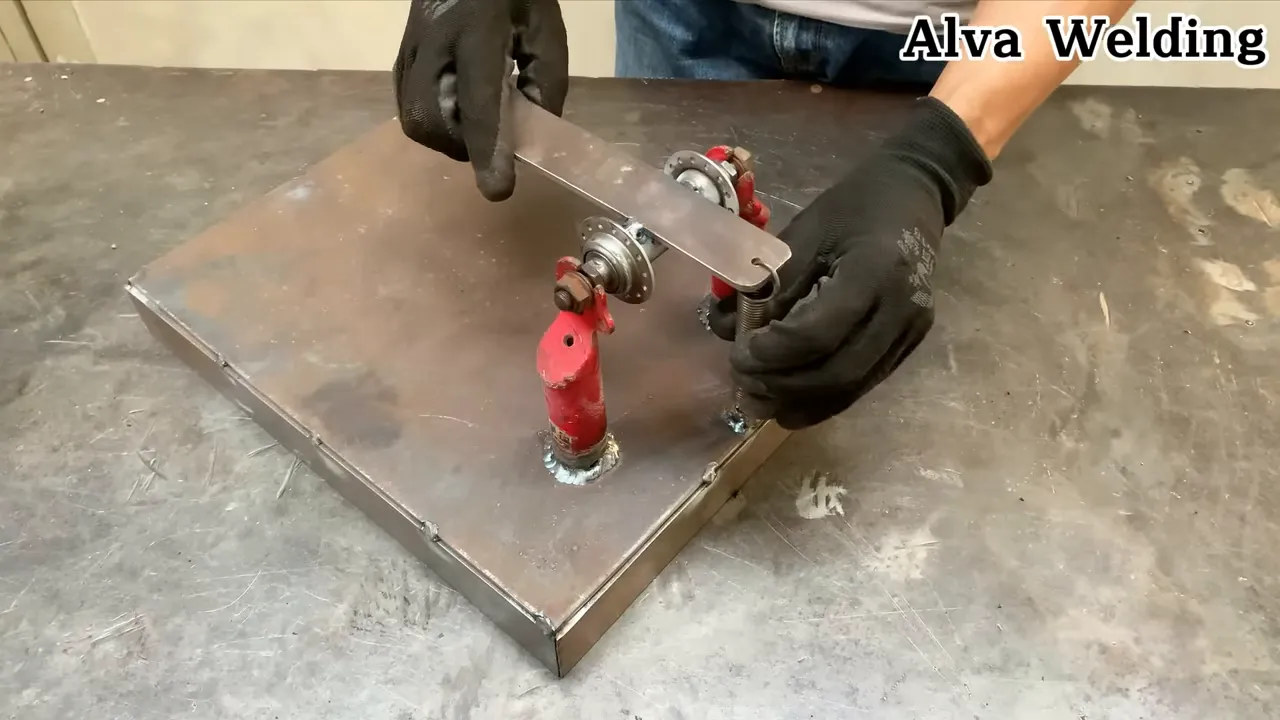 Alva speaking while working on a small part