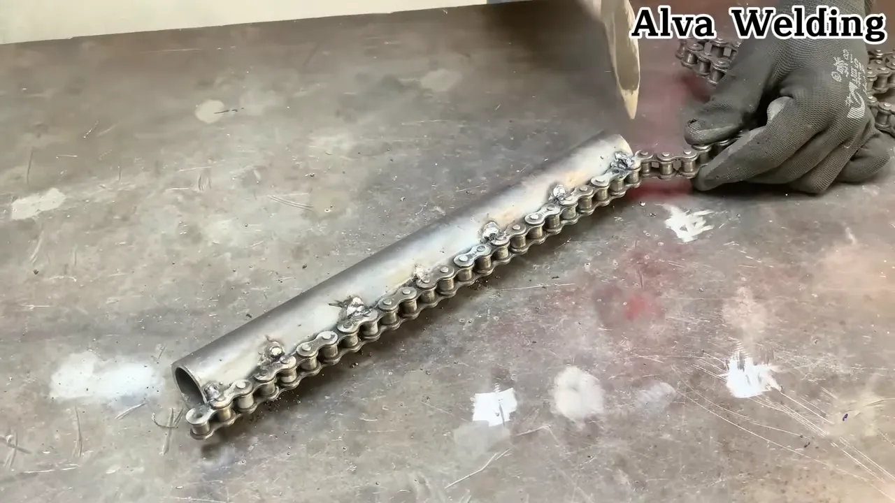 Close-up of sprocket and motorcycle chain laid out for inspection