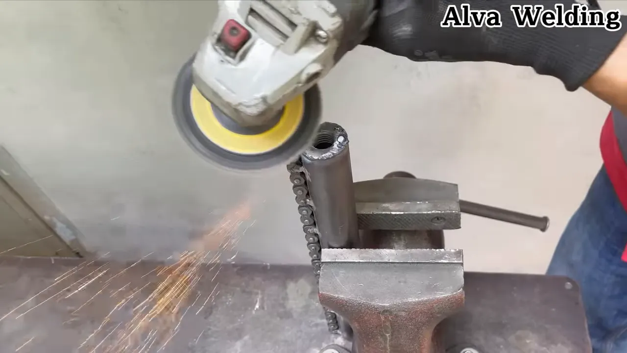 Cutting a chain link with an angle grinder