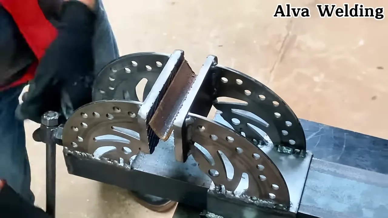 Close view of motorcycle brake disc vise alignment with welded jaw plates